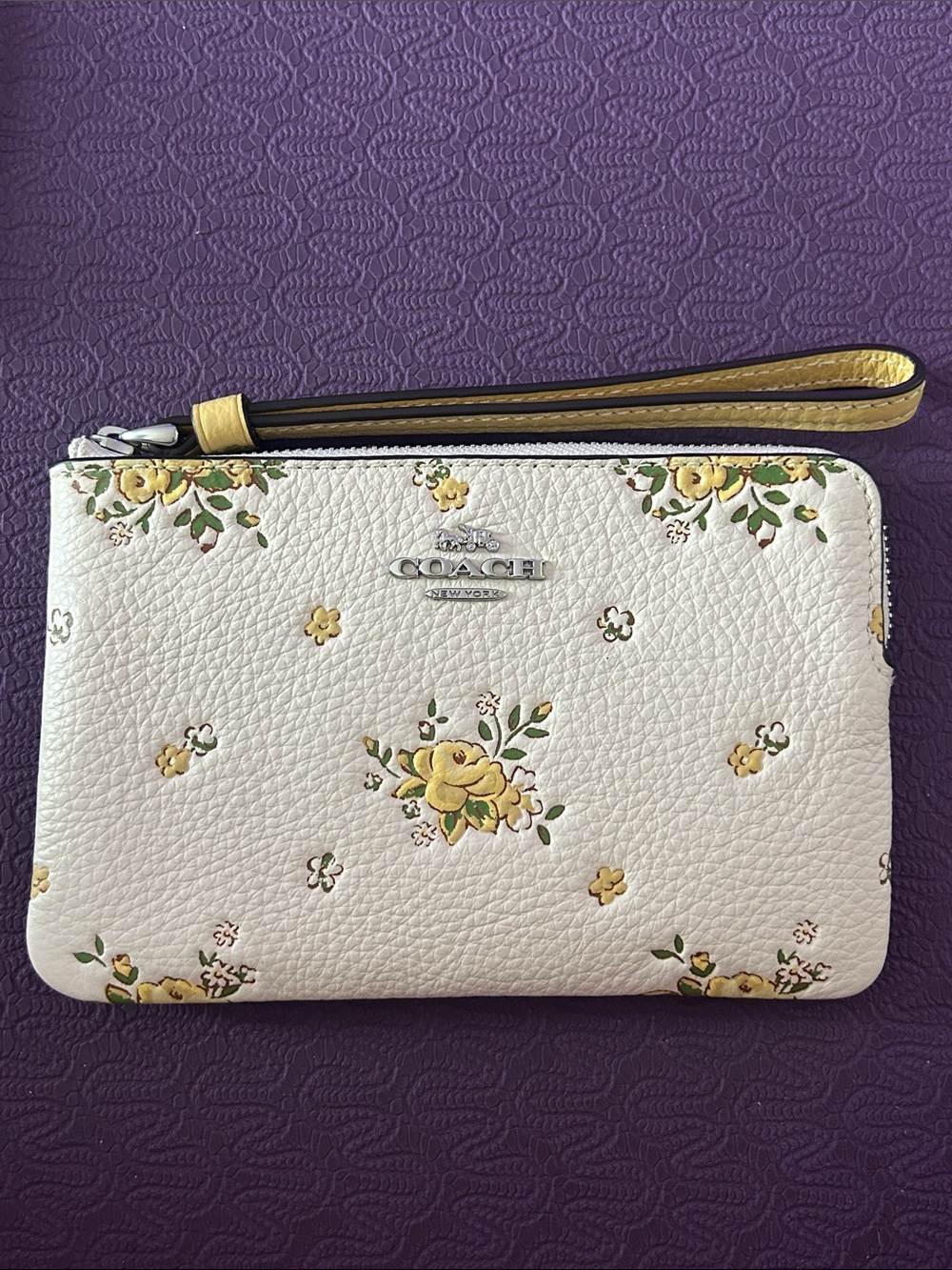 COACH White Floral Leather Wristlet with Yellow Accents